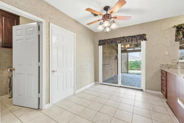 a view of an entryway with a chandelier fan