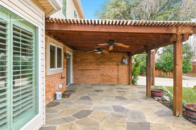 a view of a patio with table and chairs a barbeque