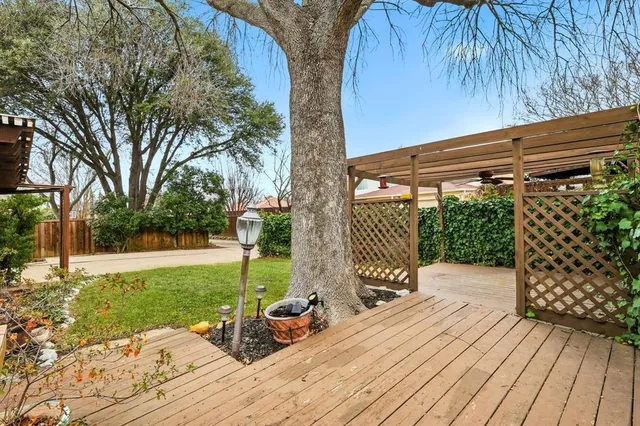 a view of a backyard with sitting area