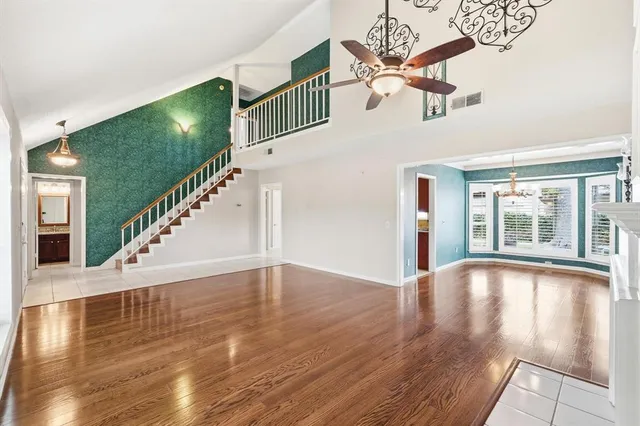 a view of an entryway with wooden floor