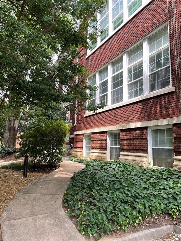 1031 State Street Northwest, Unit 205 Atlanta, GA 30318 - Photo 19 of 29 a front view of a house with a garden