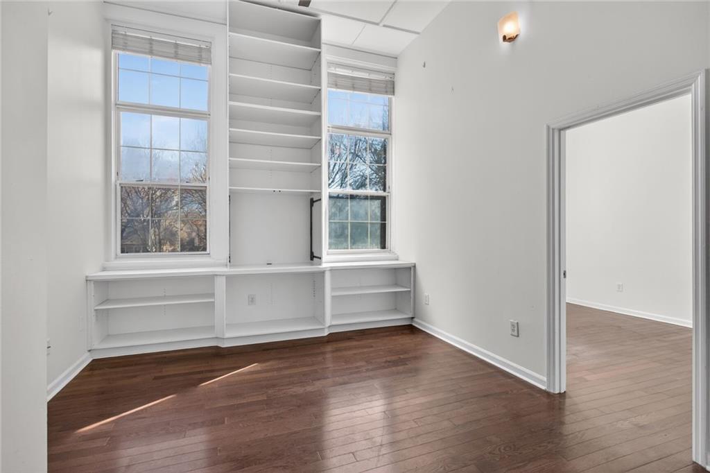 1031 State Street Northwest, Unit 205 Atlanta, GA 30318 - Photo 24 of 29 a view of walk in closet with empty racks