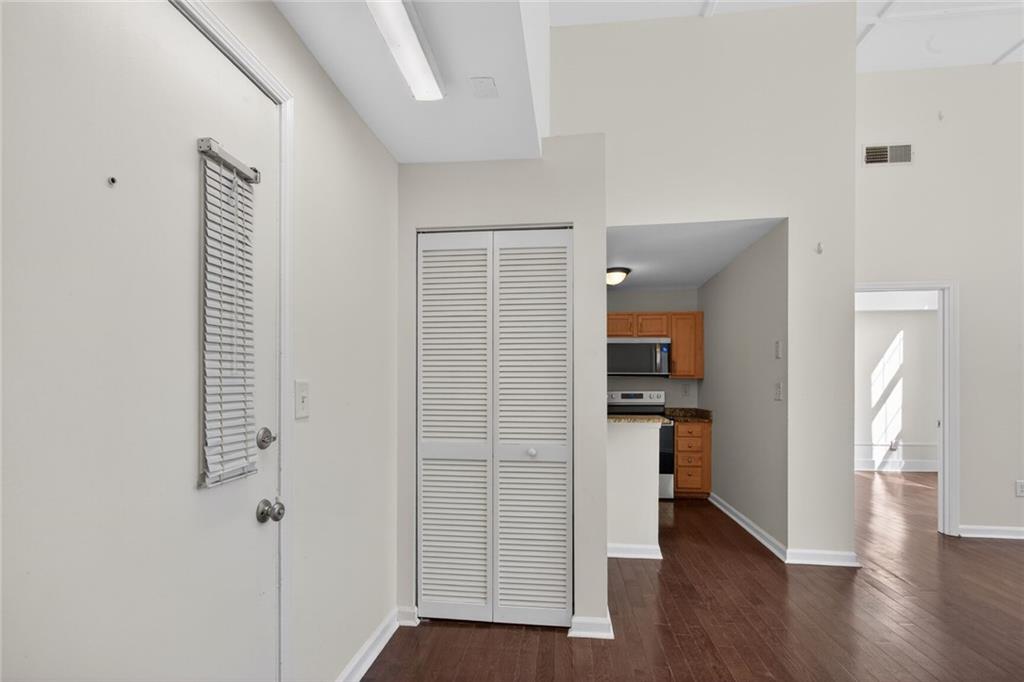 1031 State Street Northwest, Unit 205 Atlanta, GA 30318 - Photo 3 of 29 a view of a hallway view with wooden floor and staircase