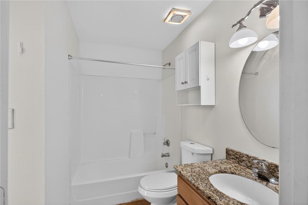 1031 State Street Northwest, Unit 205 Atlanta, GA 30318 - Photo 10 of 29 a bathroom with a sink toilet and shower