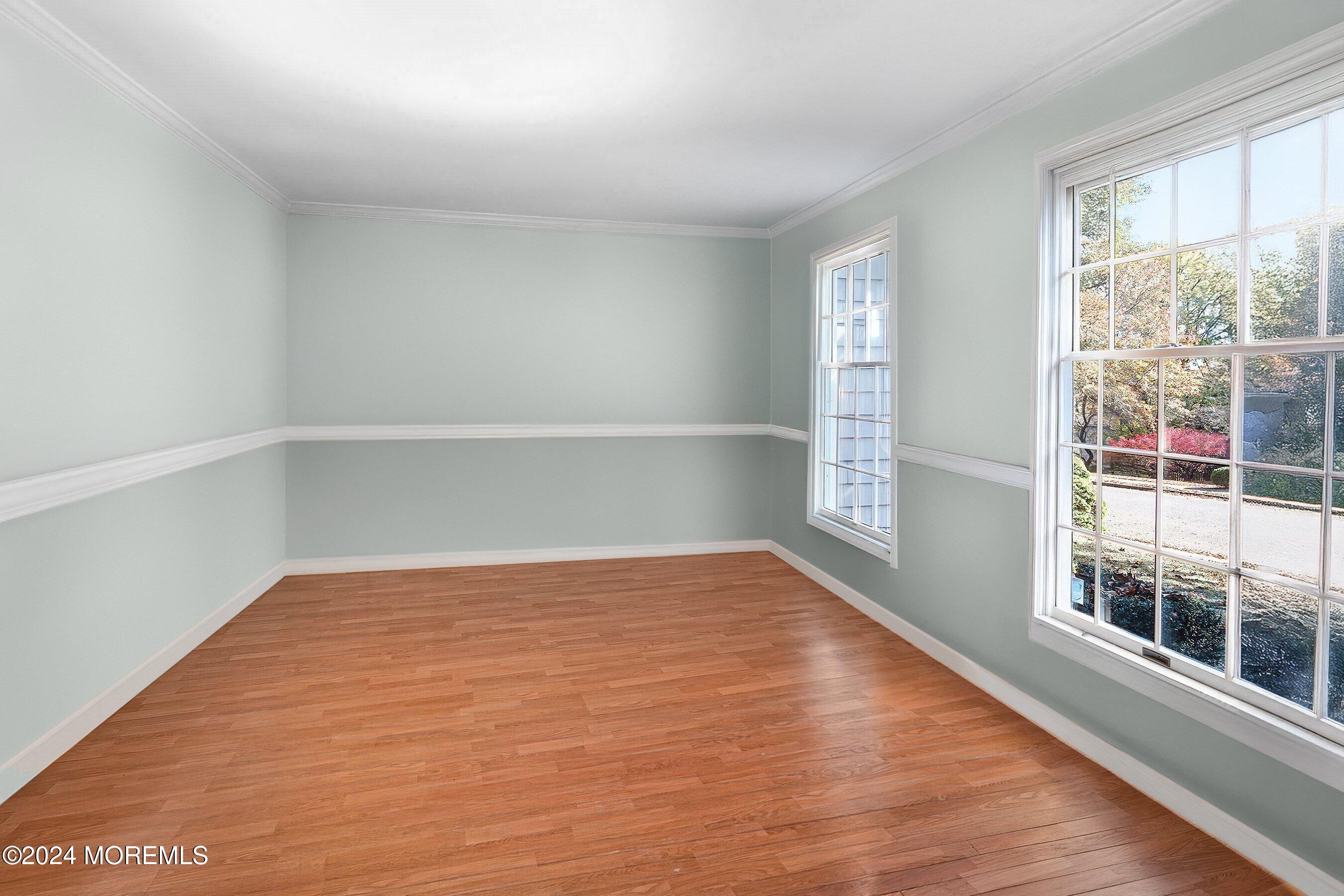 31 Doherty Drive Middletown, NJ 07748 - Photo 12 of 16 a view of an empty room with wooden floor and a window