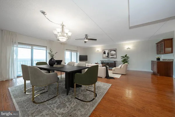 a view of a dining room with furniture window and wooden floor
