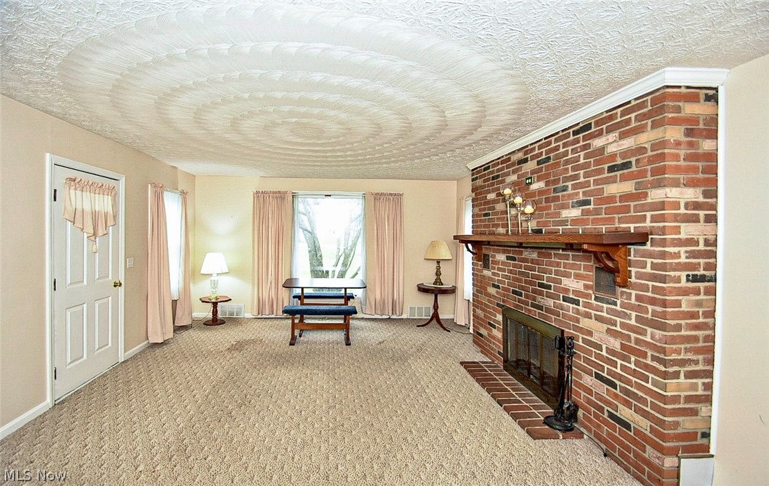 4543 South Arlington Road Uniontown, OH 44685 - Photo 3 of 25 Additional view of living room w/brick fireplace