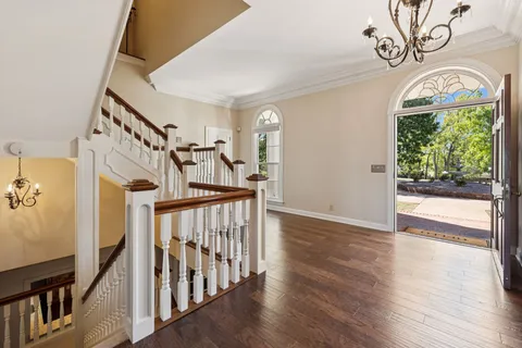 a view of a house with backyard porch and sitting area