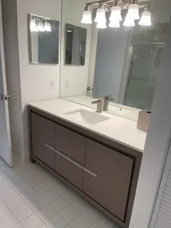 a bathroom with a sink and a mirror