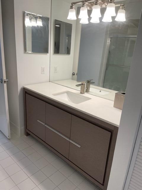 3594 South Ocean Boulevard, Unit 205 Highland Beach, FL 33487 - Photo 13 of 44 a bathroom with a sink and a mirror