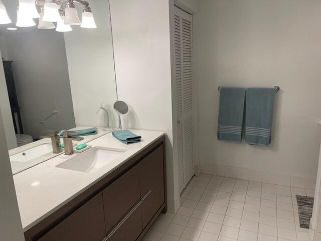 3594 South Ocean Boulevard, Unit 205 Highland Beach, FL 33487 - Photo 14 of 44 a bathroom with a sink a vanity and a mirror