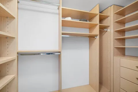 a view of an empty walk in closet
