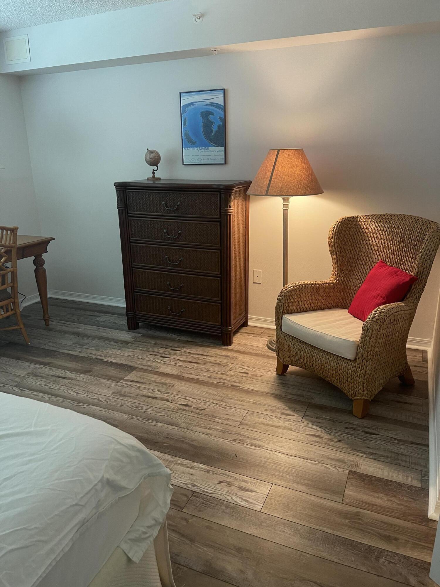 3594 South Ocean Boulevard, Unit 205 Highland Beach, FL 33487 - Photo 20 of 44 a living room with furniture and a lamp