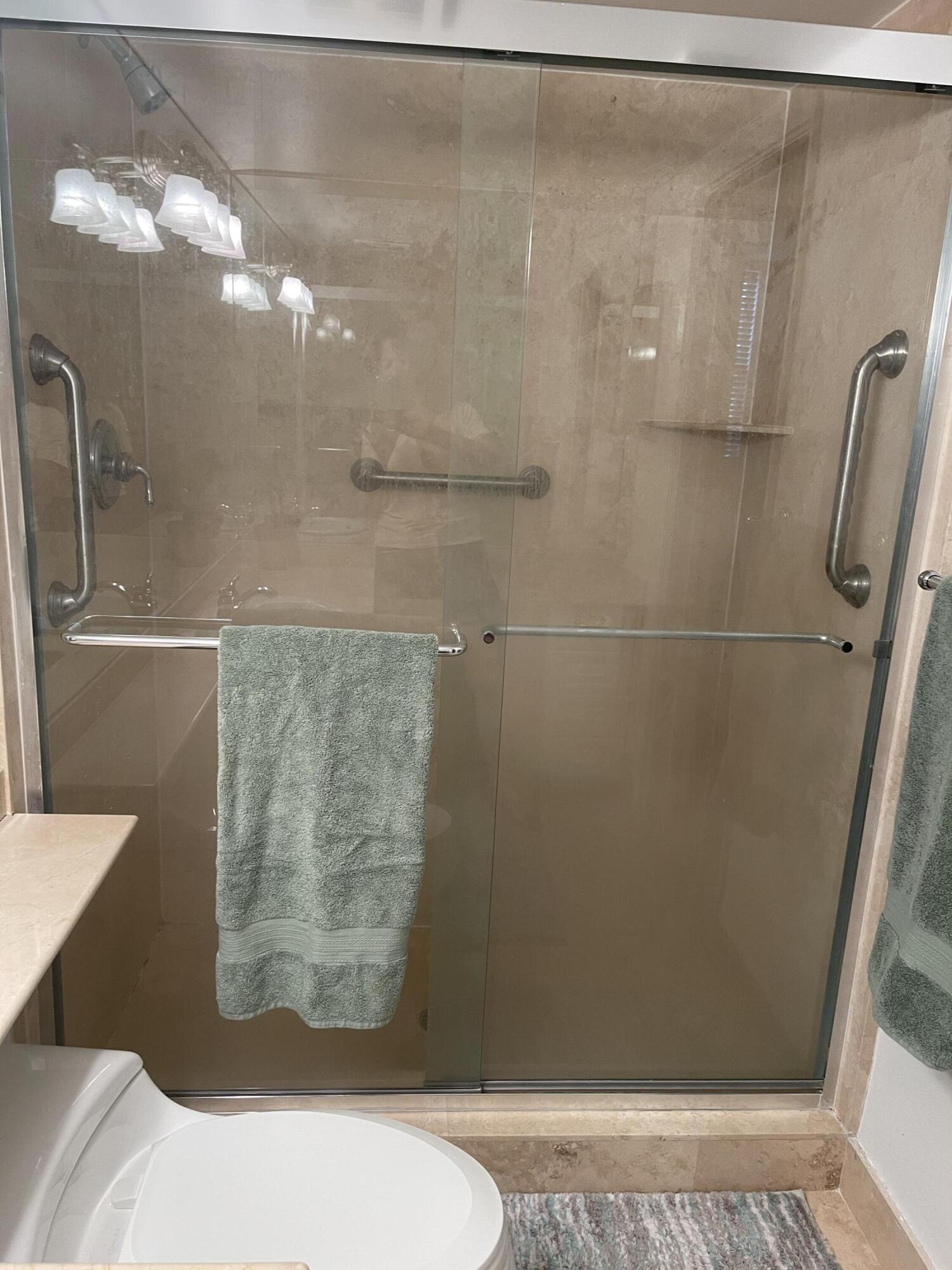 3594 South Ocean Boulevard, Unit 205 Highland Beach, FL 33487 - Photo 24 of 44 a bathroom with a shower