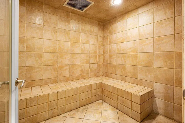 a room with furniture pool table and windows