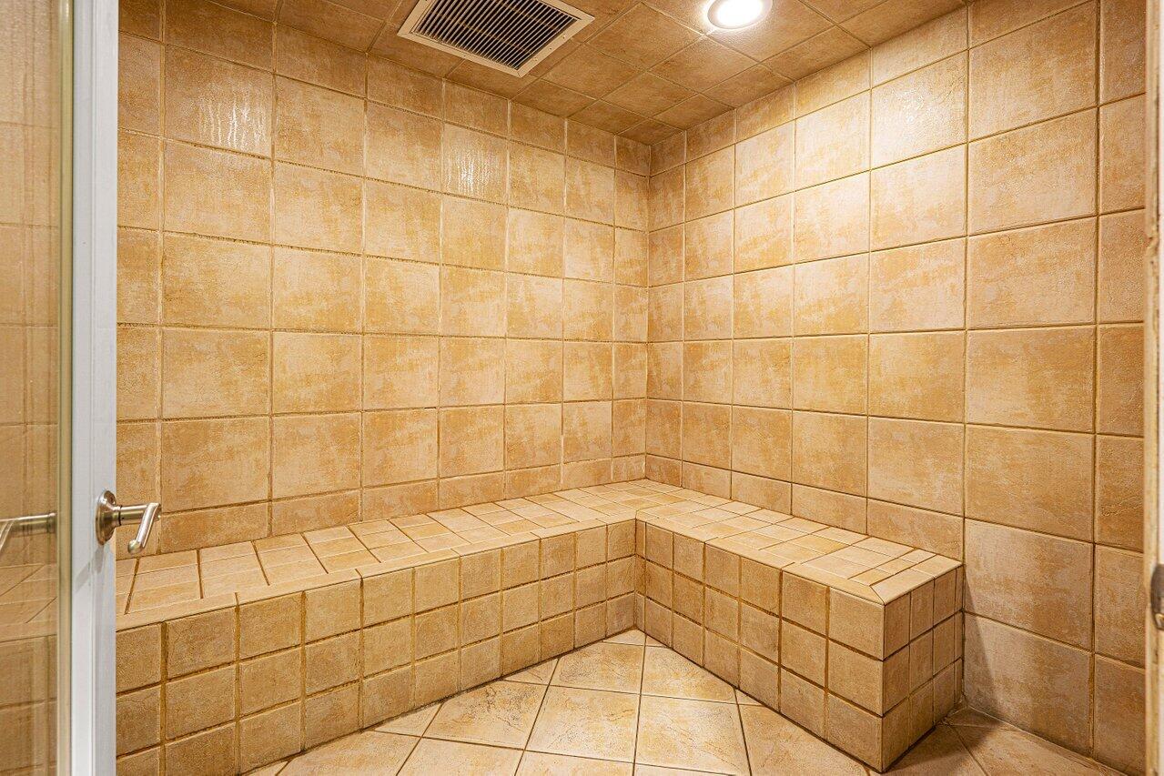 3594 South Ocean Boulevard, Unit 205 Highland Beach, FL 33487 - Photo 40 of 44 a bathroom with a shower