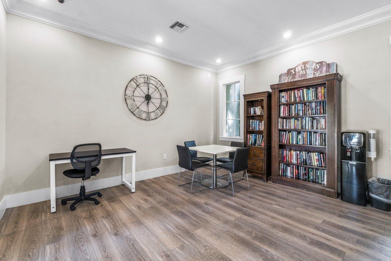 3594 South Ocean Boulevard, Unit 205 Highland Beach, FL 33487 - Photo 42 of 44 a living room with furniture and a book shelf