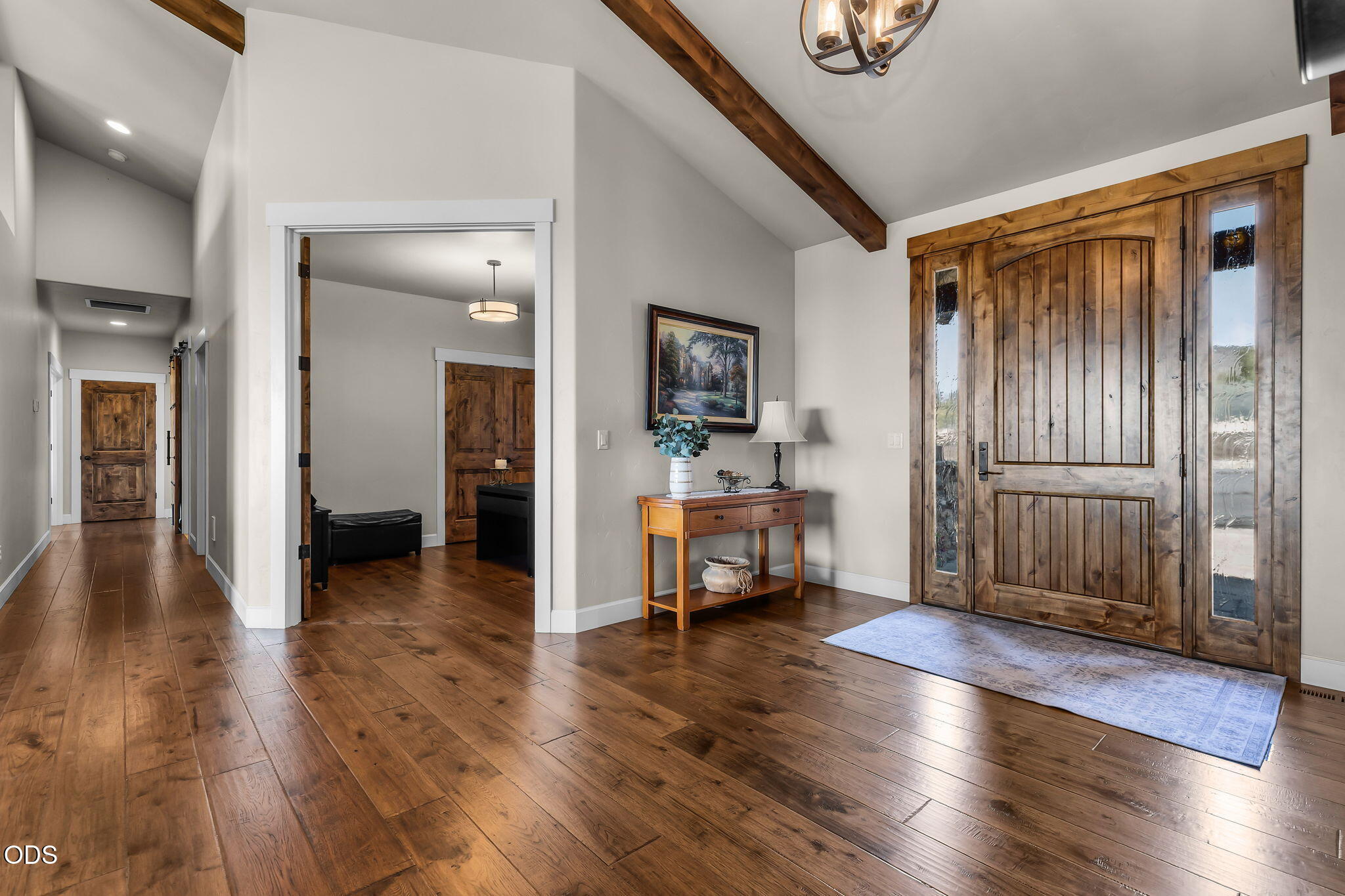 13601 Southwest Harrison Way Powell Butte, OR 97753 - Photo 13 of 81 a view of a livingroom with wooden floor and a kitchen space