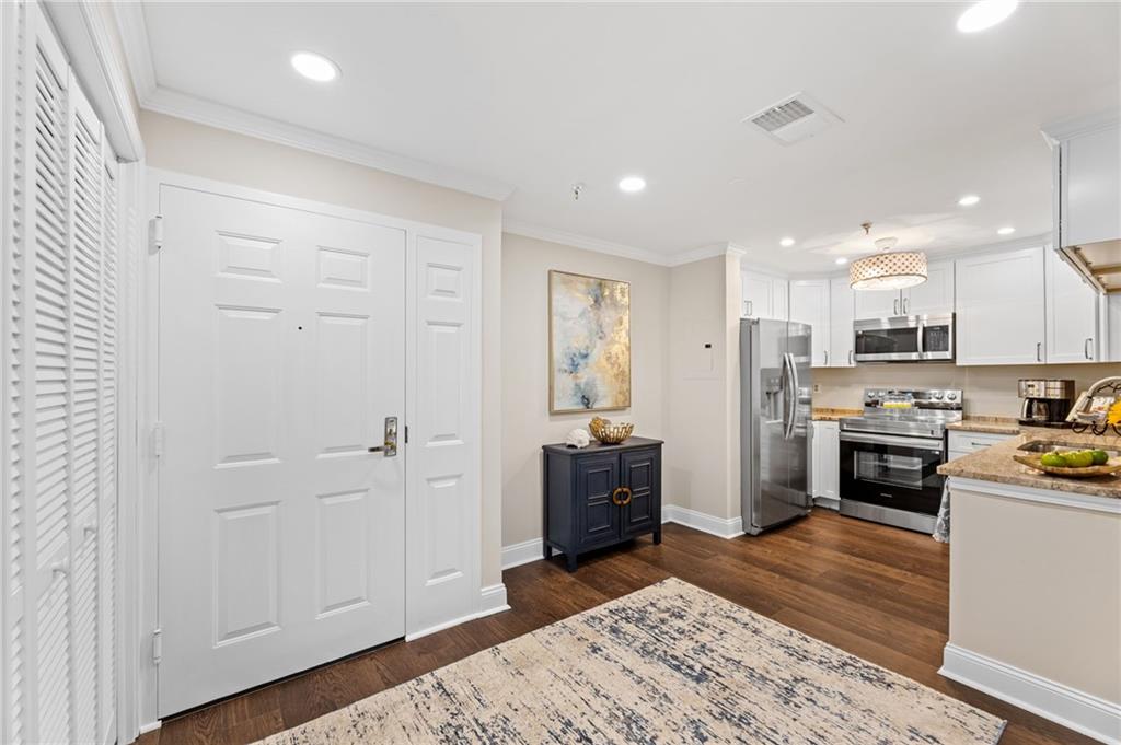 1800 Clairmont Lake Decatur, GA 30033 - Photo 11 of 31 a open kitchen with white cabinets and stainless steel appliances