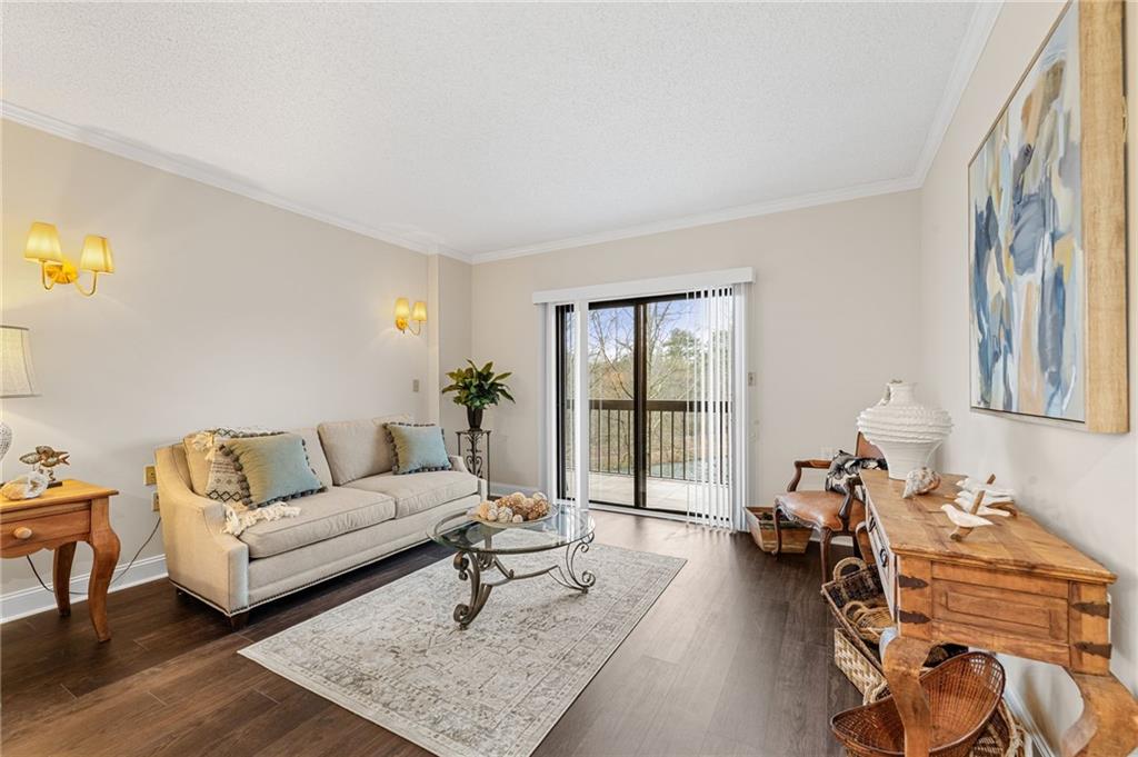 1800 Clairmont Lake Decatur, GA 30033 - Photo 16 of 31 a living room with furniture a table and wooden floor