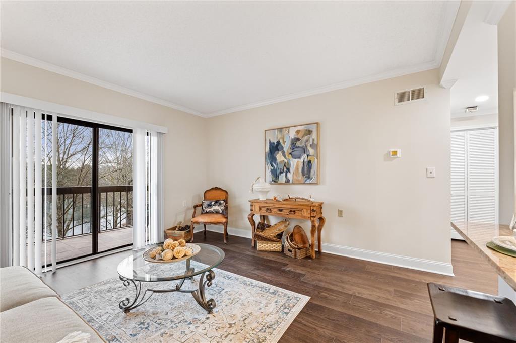 1800 Clairmont Lake Decatur, GA 30033 - Photo 19 of 31 a living room with furniture a rug potted plant and a large window