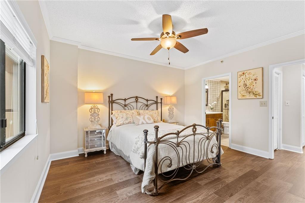 1800 Clairmont Lake Decatur, GA 30033 - Photo 20 of 31 a bedroom with a bed and a chandelier