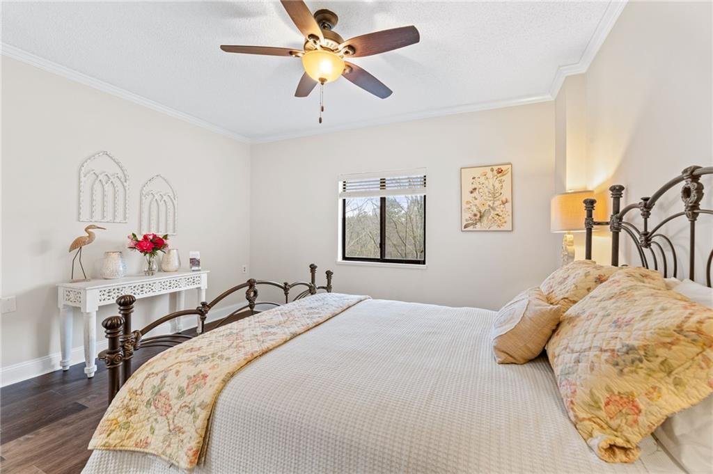 1800 Clairmont Lake Decatur, GA 30033 - Photo 21 of 31 a bedroom with a bed and a chandelier