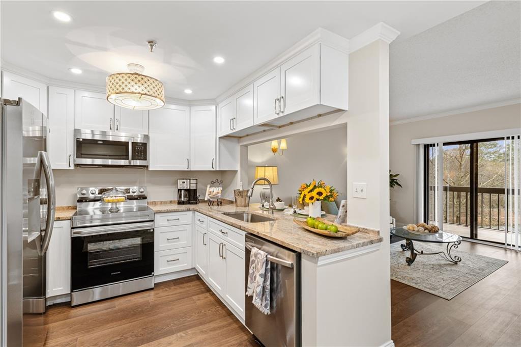 1800 Clairmont Lake Decatur, GA 30033 - Photo 3 of 31 a kitchen with a sink cabinets and stainless steel appliances
