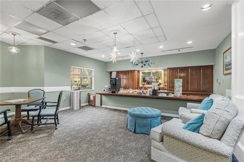 1800 Clairmont Lake Decatur, GA 30033 - Photo 31 of 31 a living room with fireplace furniture and a kitchen view
