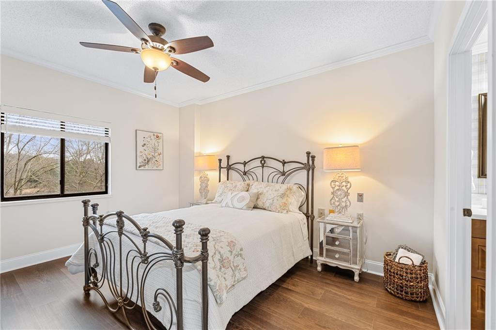 1800 Clairmont Lake Decatur, GA 30033 - Photo 5 of 31 a bedroom with a large bed and a chandelier