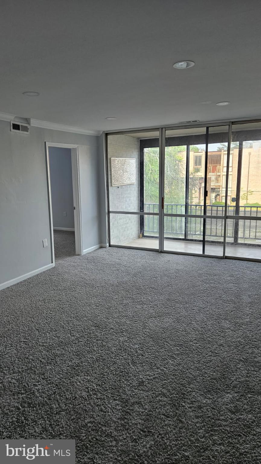 8671 Greenbelt Road, Unit 101 Greenbelt, MD 20770 - Photo 13 of 15 a view of an empty room with a window