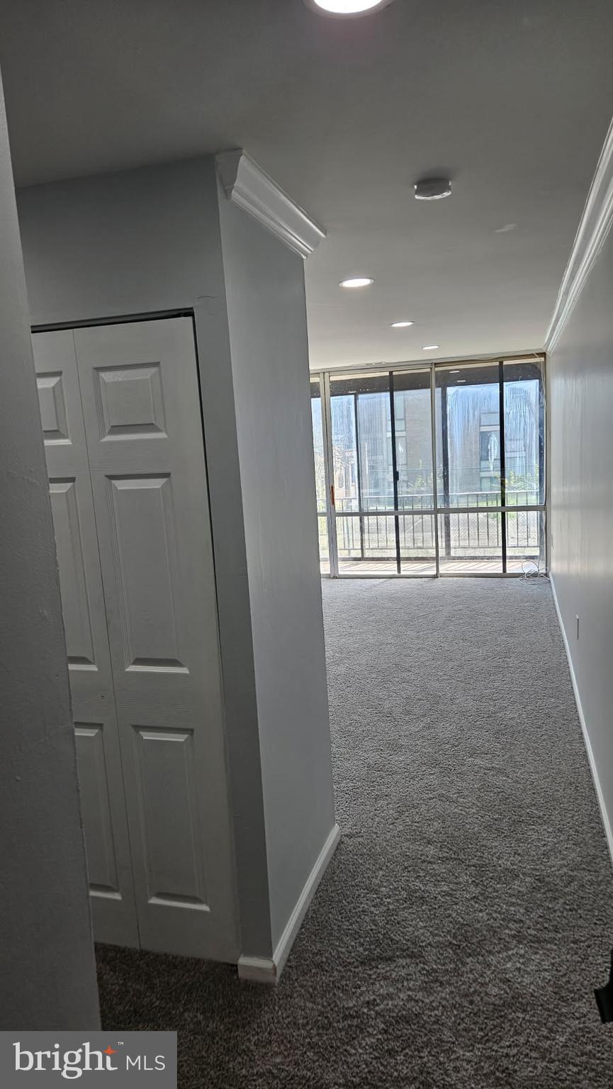 8671 Greenbelt Road, Unit 101 Greenbelt, MD 20770 - Photo 5 of 15 a view of an empty room with a window