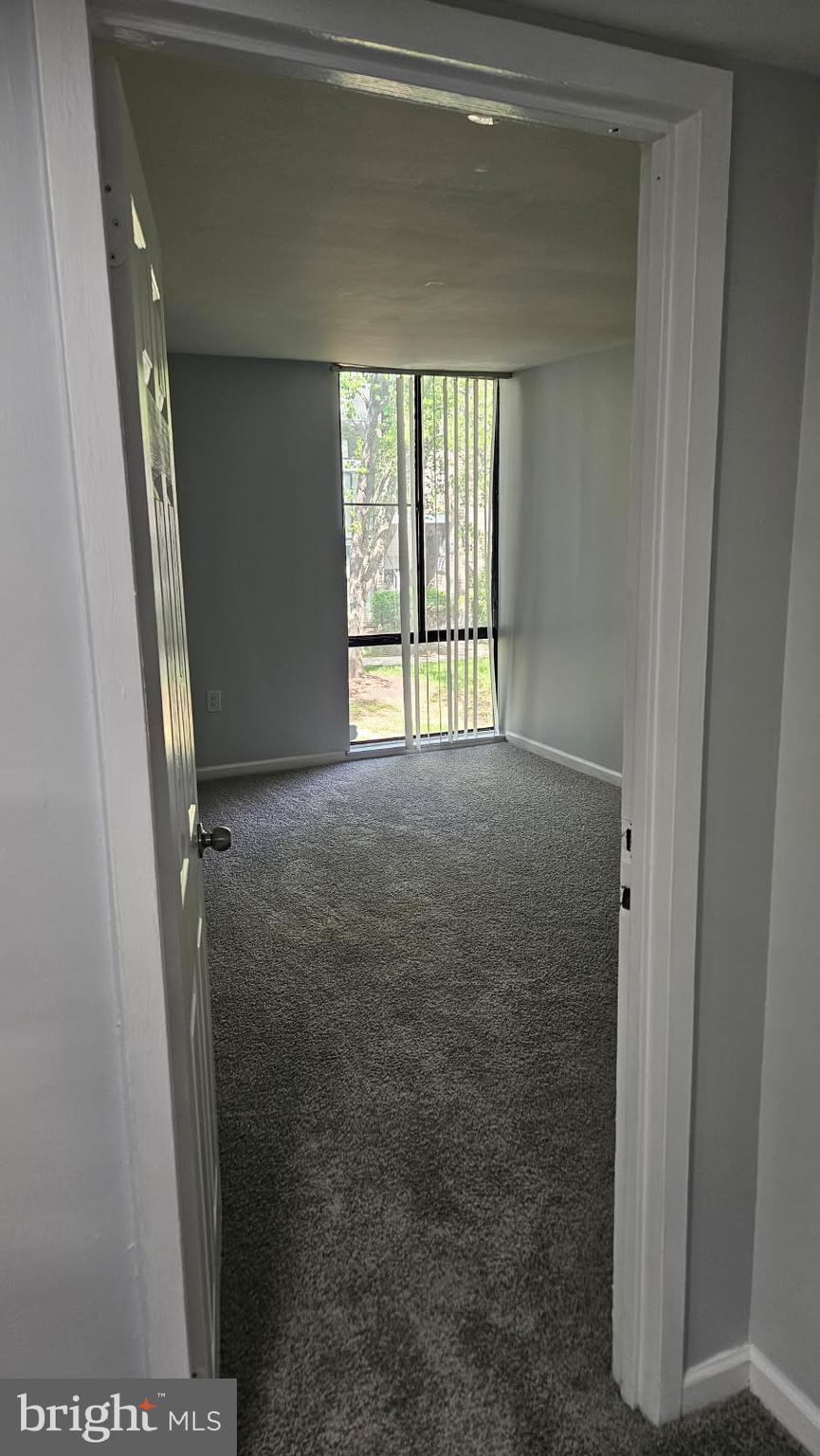 8671 Greenbelt Road, Unit 101 Greenbelt, MD 20770 - Photo 6 of 15 a view of an empty room with a window