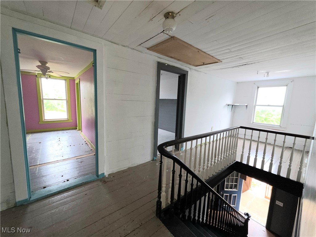 10 Browns Ridge Road Rockport, WV 26169 - Photo 12 of 35 Corridor with an upstairs landing, wood-type flooring, and wood ceiling