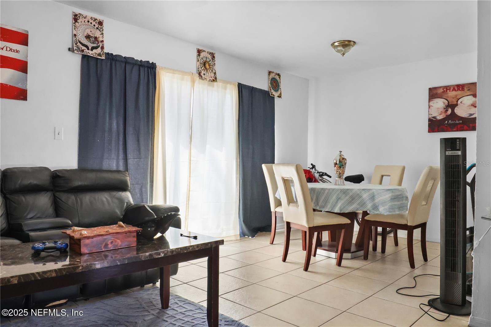 1110 Southwest 62nd Terrace Gainesville, FL 32607 - Photo 12 of 24 a living room with furniture and a window