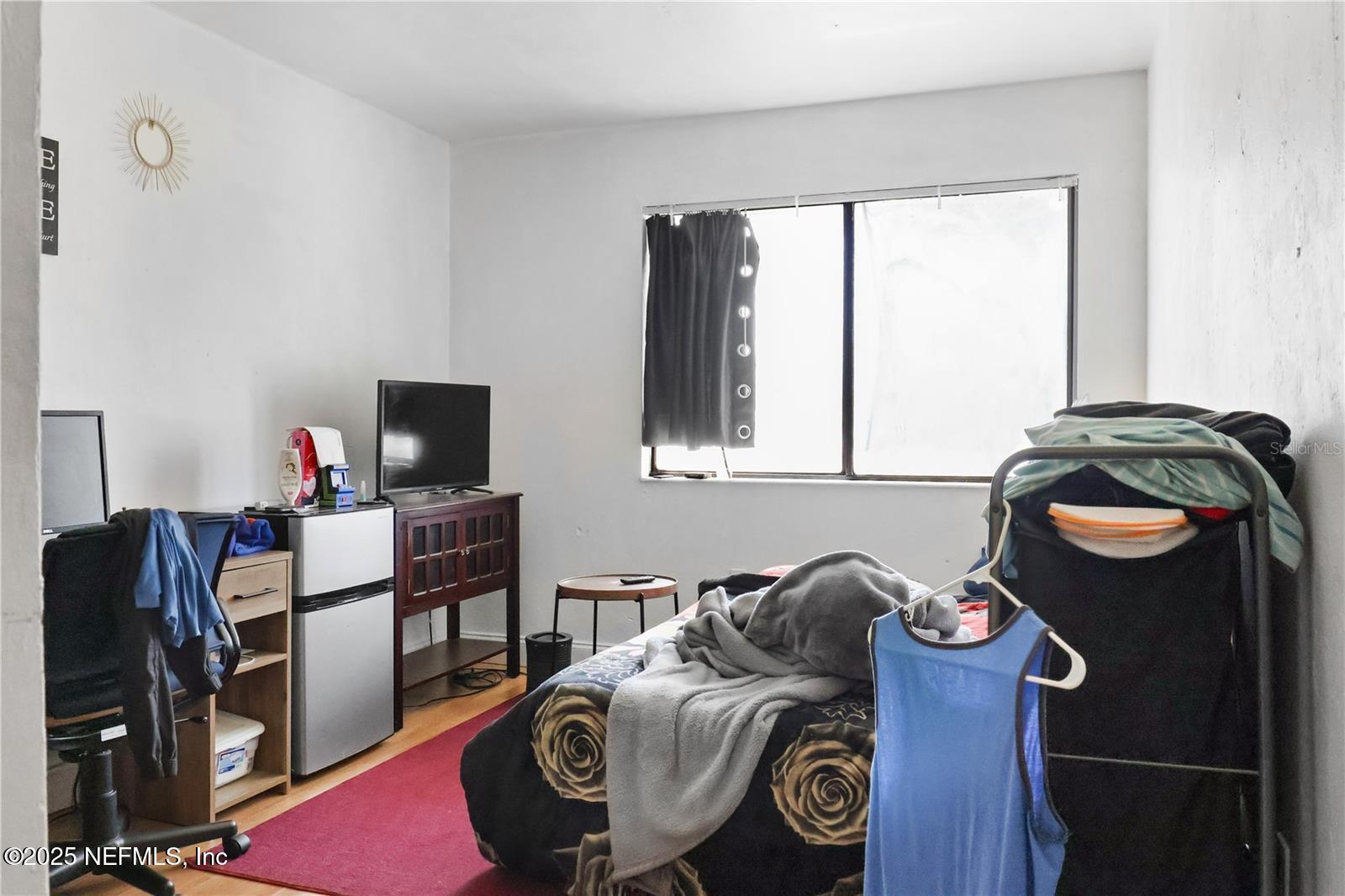 1110 Southwest 62nd Terrace Gainesville, FL 32607 - Photo 13 of 24 a bedroom with furniture and a window