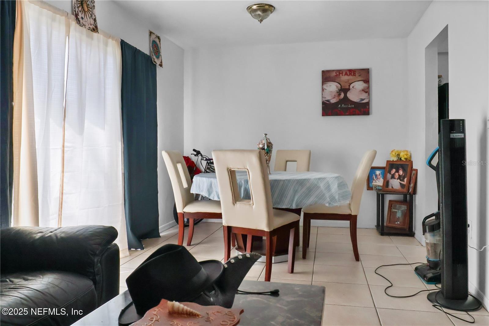 1110 Southwest 62nd Terrace Gainesville, FL 32607 - Photo 18 of 24 a view of a livingroom with furniture and a window