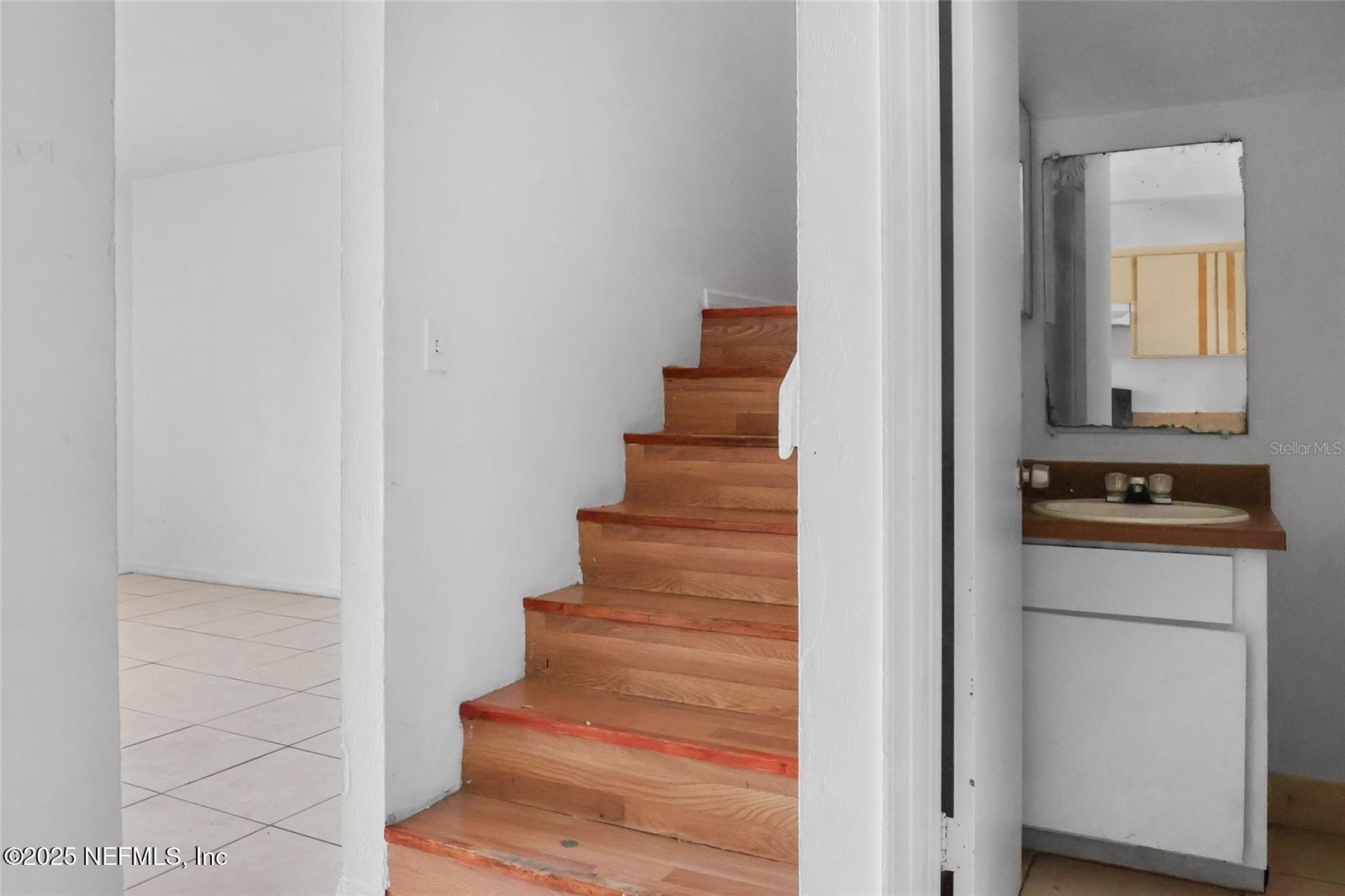 1110 Southwest 62nd Terrace Gainesville, FL 32607 - Photo 21 of 24 a view of entryway and hall with wooden floor