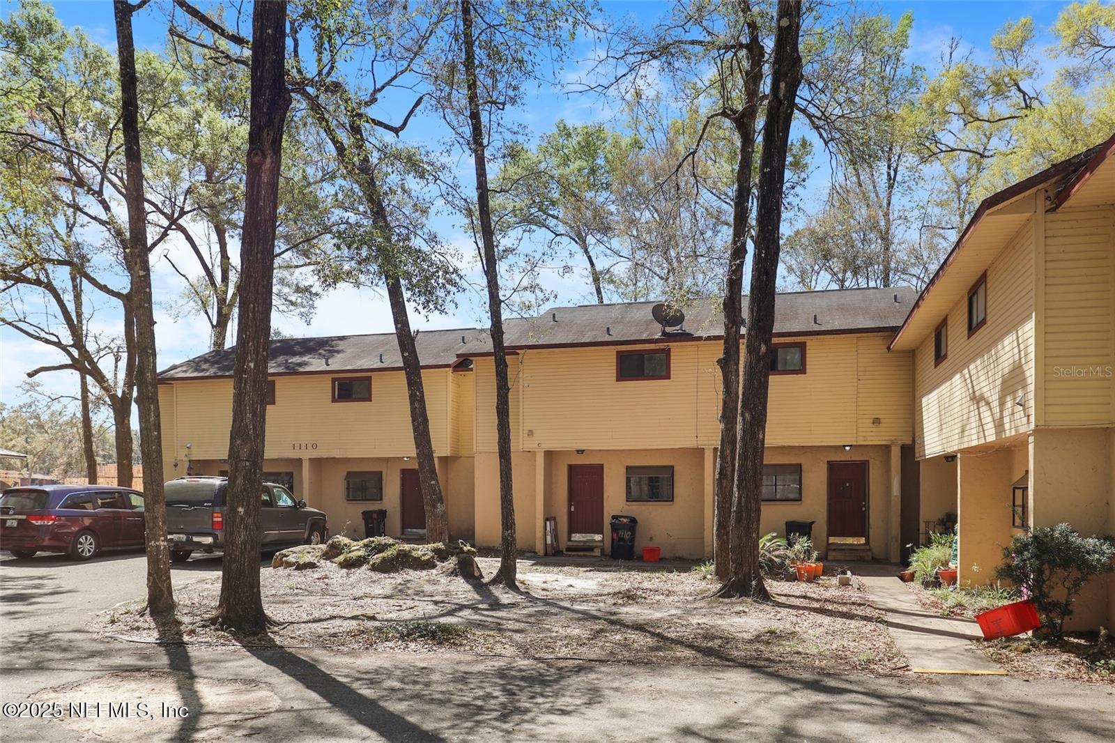 1110 Southwest 62nd Terrace Gainesville, FL 32607 - Photo 23 of 24 a view of a trees in front of a building