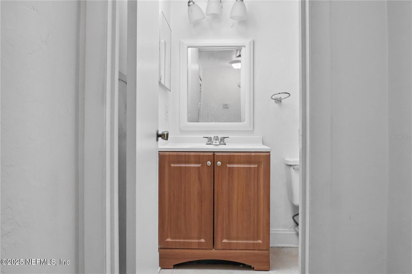 1110 Southwest 62nd Terrace Gainesville, FL 32607 - Photo 9 of 24 a bathroom with a sink and a mirror
