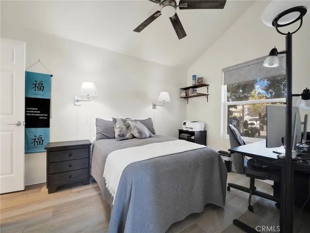 a bed room with a bed and a window