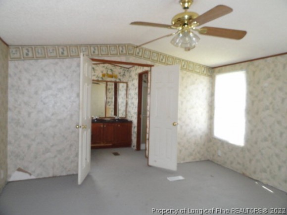240 Youngs Road Vass, NC 28394 - Photo 3 of 8 a view of an empty room with a window