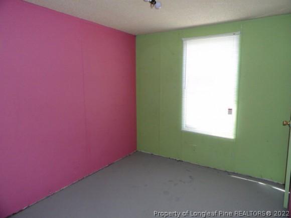 240 Youngs Road Vass, NC 28394 - Photo 5 of 8 a view of empty room with window