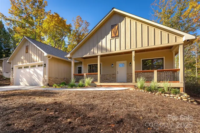 a kitchen with a sink a refrigerator a stove and wooden floor