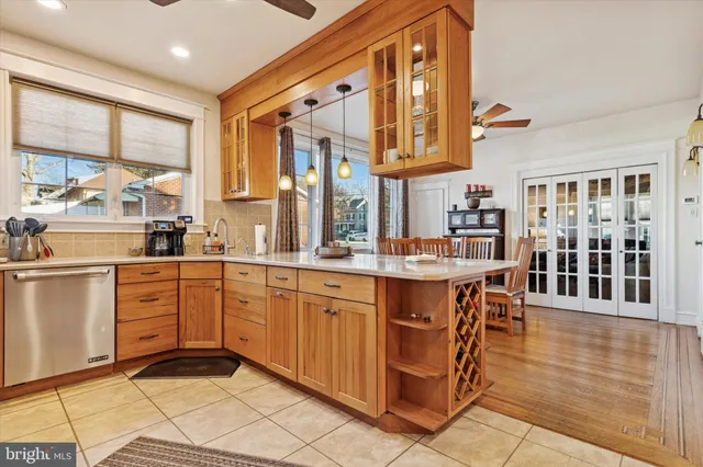 a kitchen with stainless steel appliances granite countertop a stove and cabinets