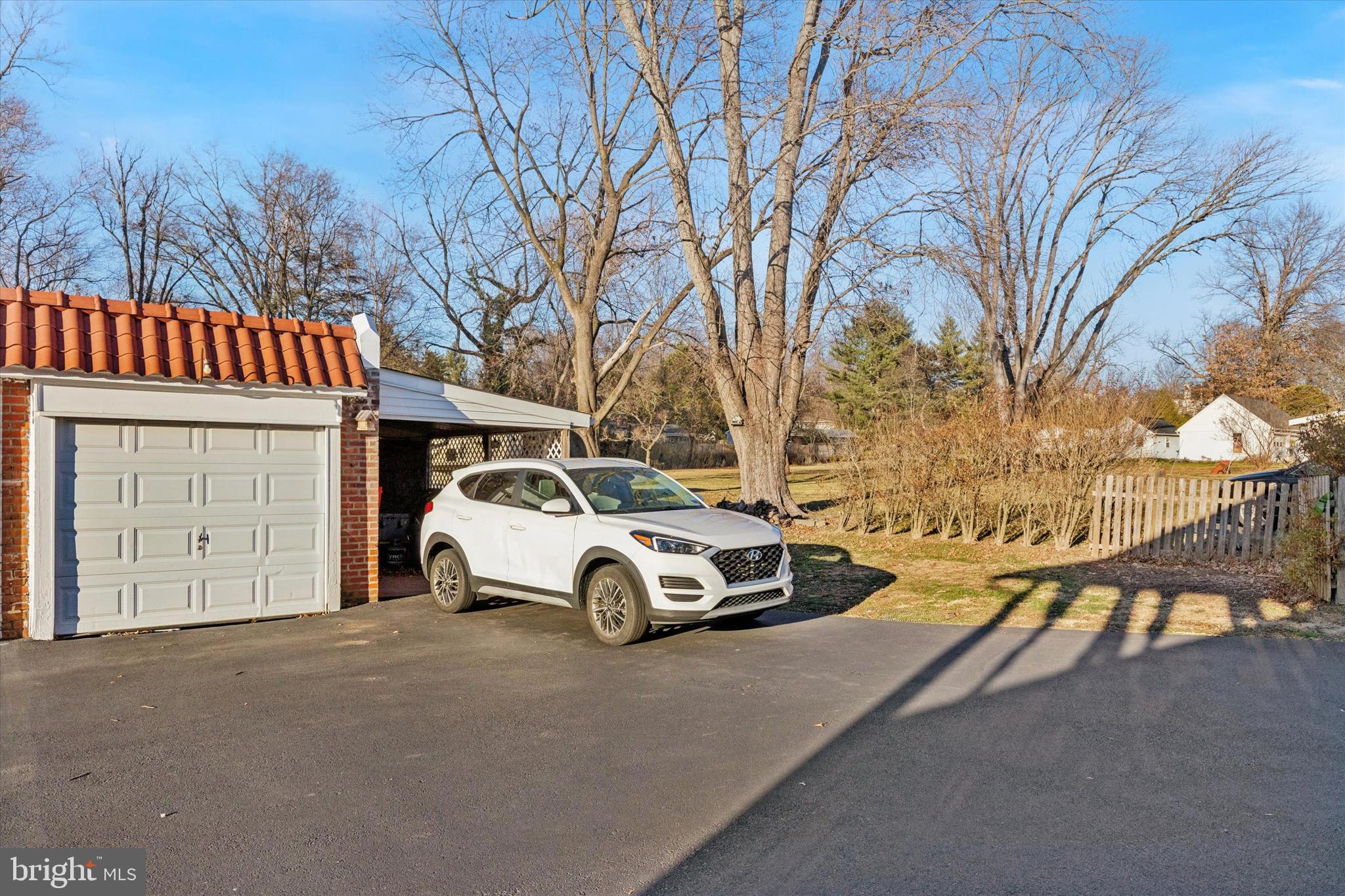 6329 East Valley Green Road Flourtown, PA 19031 - Photo 2 of 23 a car parked in front of a house