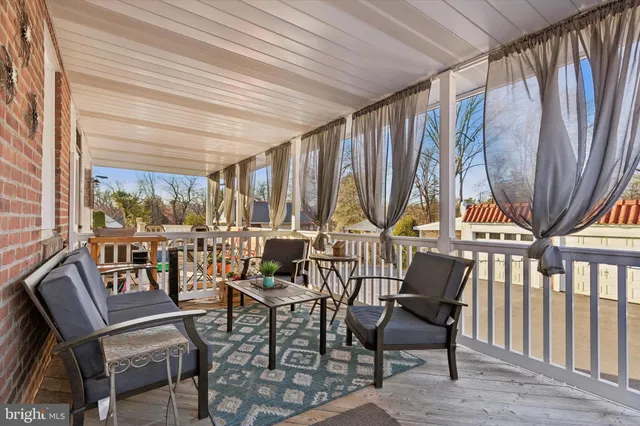 a view of an chairs and table in the balcony