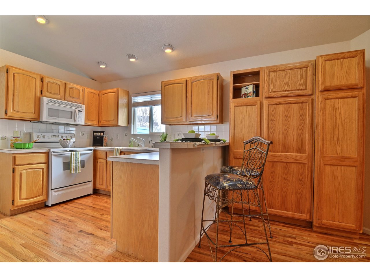 5608 West 13th Street Road Greeley, CO 80634 - Photo 12 of 25 Lovely Cabinetry and Large Pantry