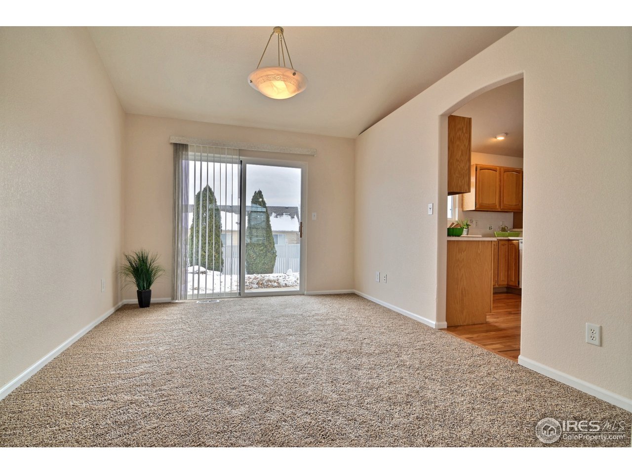 5608 West 13th Street Road Greeley, CO 80634 - Photo 8 of 25 Living Room Opens To The Formal Dining Room