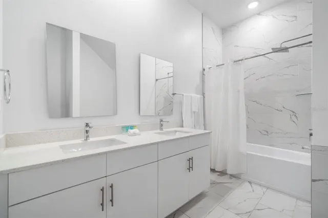 a bathroom with a tub and shower